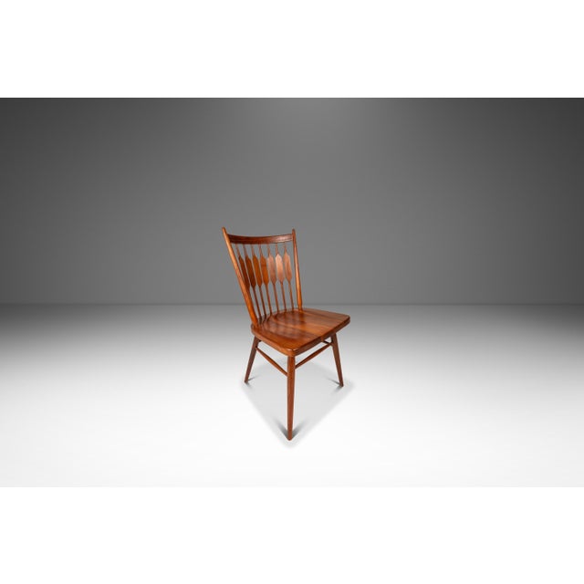 Introducing a rare, expansive set of six visually captivating "Centennial" dining chairs designed by the iconic design duo...