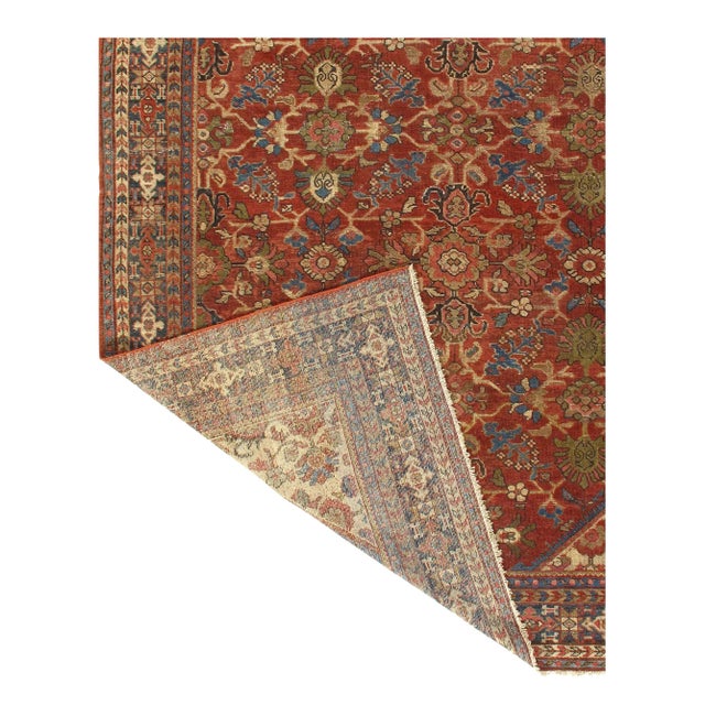 This is a vintage Persian Mahal rug from the 1900s. The piece is made of lamb's wool and cotton. This rug has a dense,...