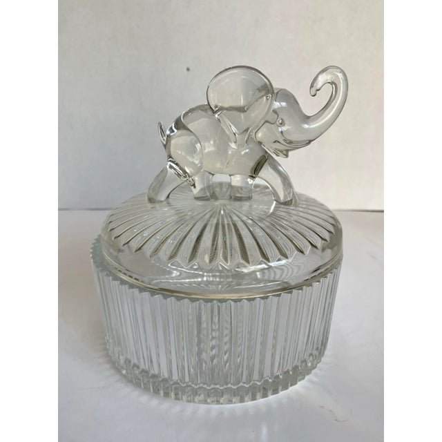 Here is a beautiful, clear glass lidded dish made by Jeannette Glass in the early 20th c. The piece features a stunning...