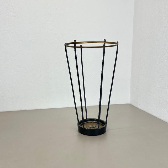 This original vintage umbrella stand element was produced in the 1950s in France. It is made of solid metal and brass....