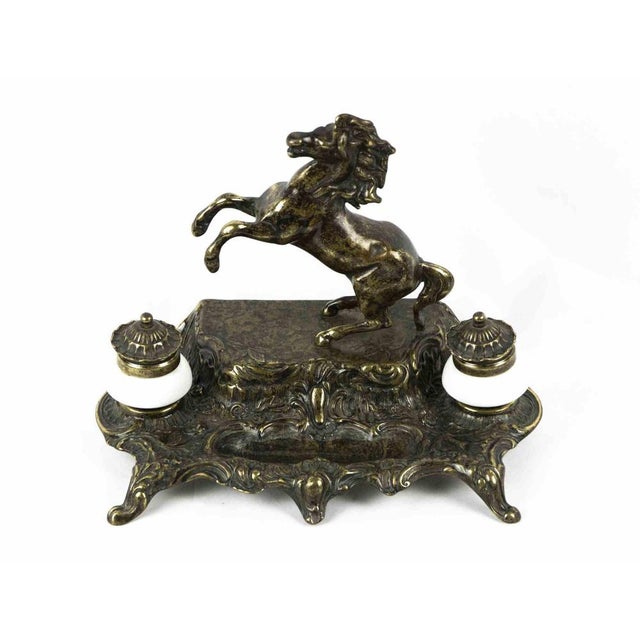 Bronze inkwell is an original decorative object realized in the mid-20th century. A very elegant bronze inkwell decorated...