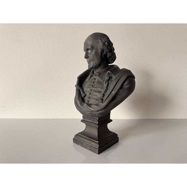 Classic vintage cast metal bust depicting William Shakespeare, presented in a traditional half-length portrait with period...