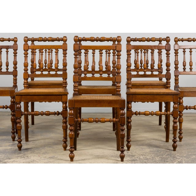 A grand set of twelve mid-19th century French Louis XIII style dining chairs, sourced from Provence, France. Each chair is...