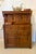 A highly decorative antique carved oak court cupboard featuring classic Ipswich carving—a regional East Anglian style...