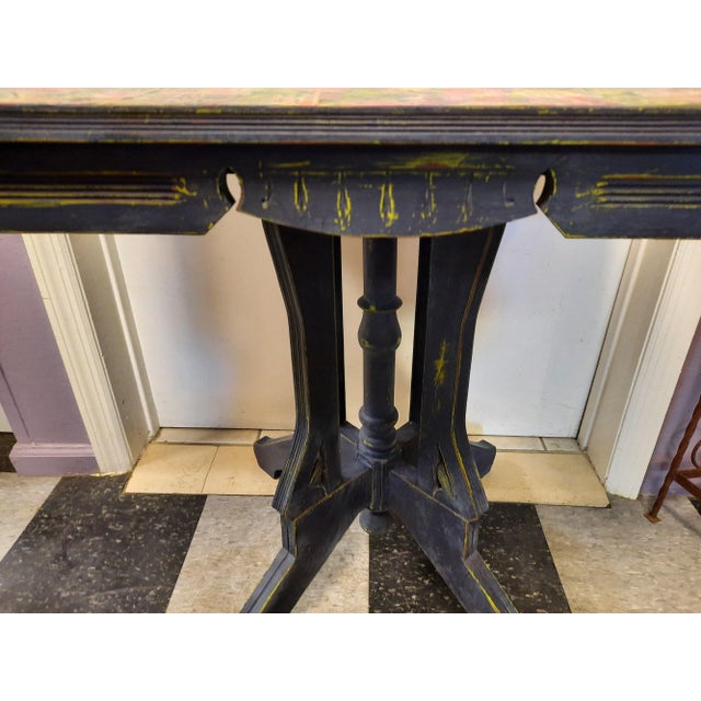 Antique Eastlake accent table. Painted a dark navy blue and hand distressed to reveal a lime green accent color. Finished...