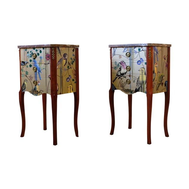A pair of Louis XV style chestwith original brass details, marble top and handles in birch wood with a gold Christian...
