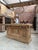 This antique firwood bar counter has been fully restored. Its front and sides are adorned with carved wooden chimeras. The...