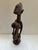 Antique African Carved Wood Fertility Statue with exagerated features. This piece is carved from one piece of wood and has...