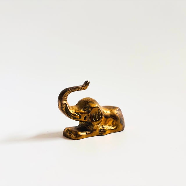 A petite vintage brass elephant.