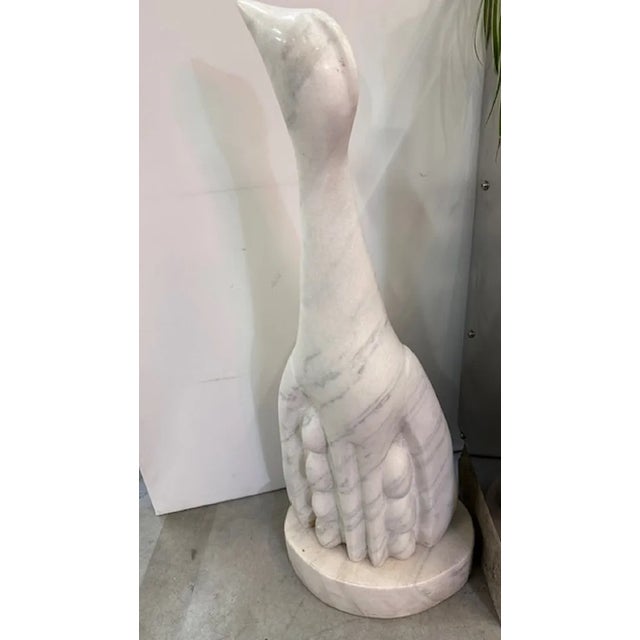 handcrafted sculpture in white marble with gray veins in the shape of a penguin or other type of bird. Stylized figure...