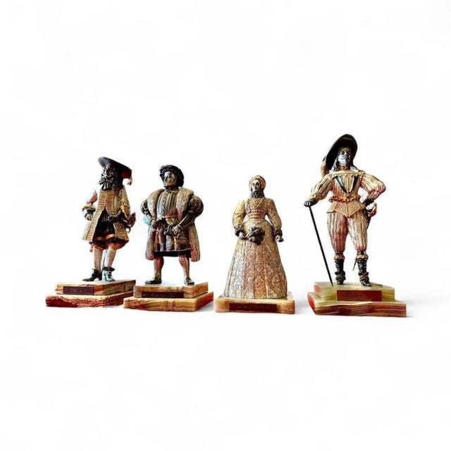 An exceptional and highly decorative set of four limited-edition british royal figures produced by the birmingham mint and...