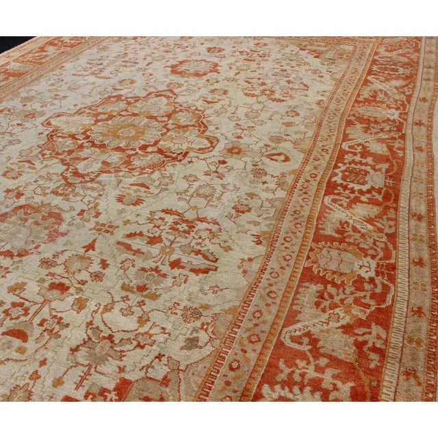 Tribal Antique Turkish Floral Oushak Rug in Cream, Rust Red, Orange and Green For Sale - Image 3 of 12