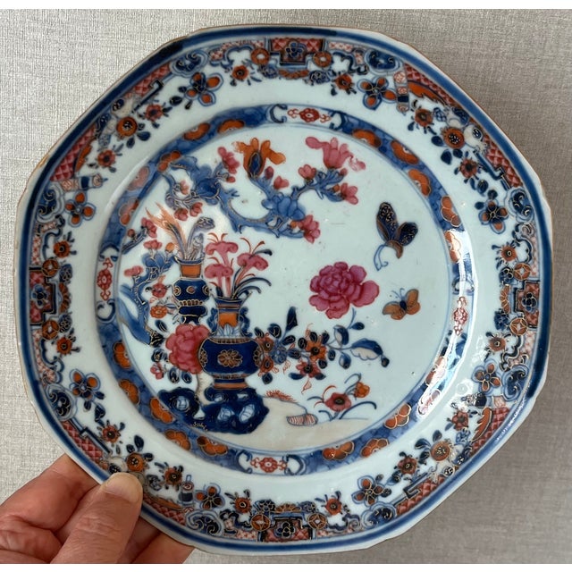 Antique 18th century Chinese export porcelain octagonal plate decorated with vases, peonies and butterflies. Measures 8...