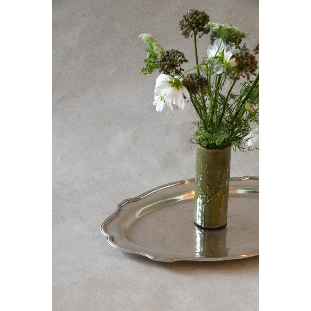 A silverplate platter with a softly scalloped edge, made by the L.B. Smith Co. Pass hors d'oeuvres or cookies on it, or...
