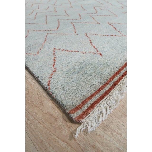 Isla Moroccan Blue Hand Knotted Wool Rug, Country of Origin: India. This exceptional piece merges the plush texture of...
