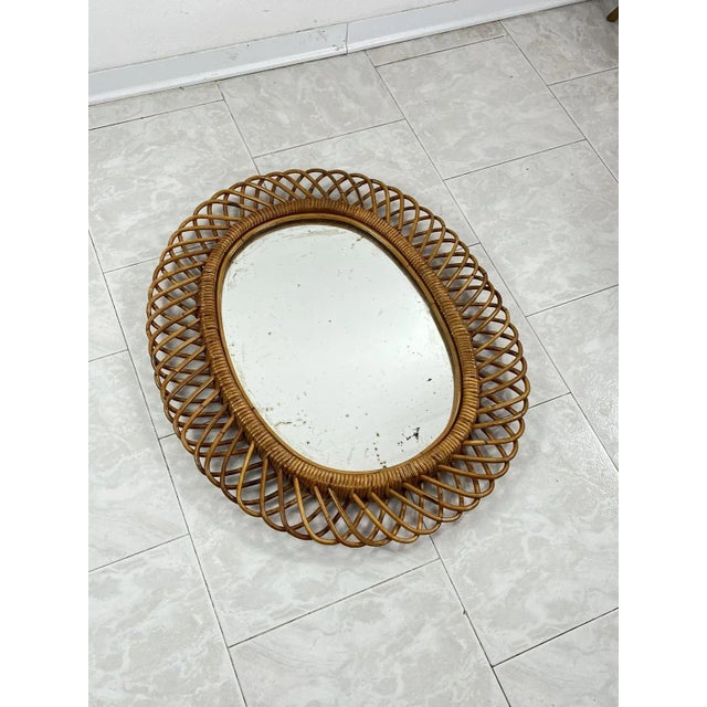 Mid-Century oval mirror in rattan and bamboo, in the style of Franco Albini, 1960s Particular design object made in Italy....