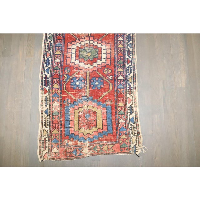 An early 20th century Worn Heriz Runner