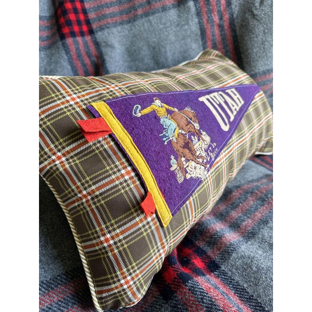 Description: Vintage Utah Rodeo Cowboy Felt Pennant from around the 1960s, unknown date. New brown plaid woven cotton...