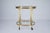 This elegant mid-century serving trolley is a refined example of Italian design from the 1950s. The piece is crafted from...