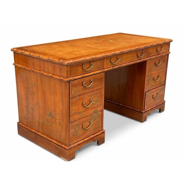 Beautiful faux bamboo desk with hand painted chinoiserie decoration and lovely brass pulls. Made by Drexel Heritage, this...