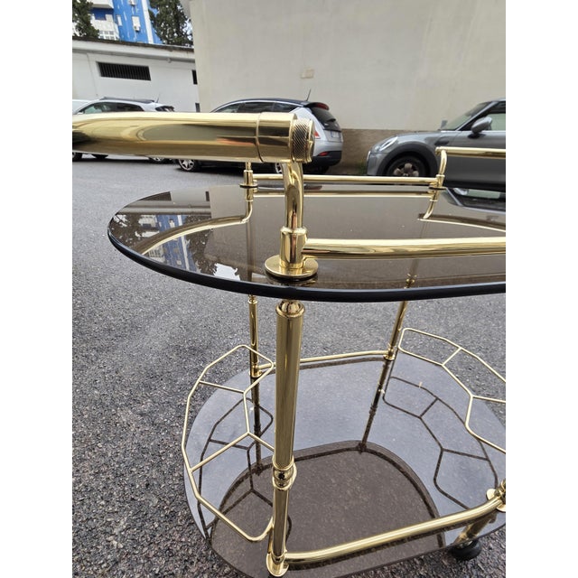 Oval Bar Trolley in Smoked Glass and Brass, 1970s, in Very Good conditions. Designed 1970 to 1979