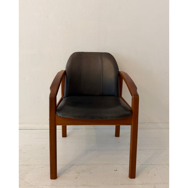 This elegant Mid-Century Modern armchair was produced in Germany during the 1960s and showcases the clean lines and...