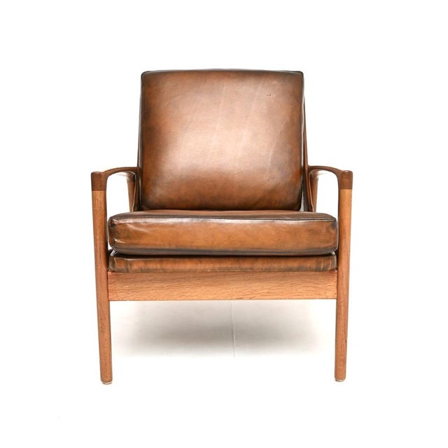 A smart and extremely well made Danish vintage oak and leather armchair by IB Kofod Larsen, dating from the 1960’s. This...