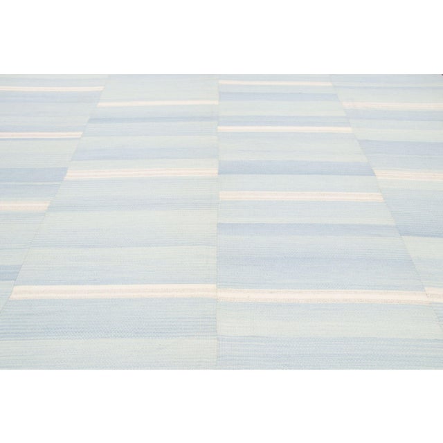 Handwoven from recycled vintage wool and originating circa 1950-1959, this 10x13 vintage Turkish kilim joins Rug & Kilim’s...