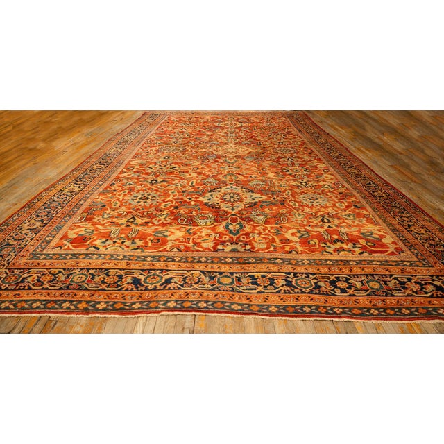 This majestic Antique Sultanabad rug, dating to circa 1890, is a definitive example of the grand-scale Persian weaving...