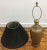 Vintage, cast metal table lamp with raised pattern. Lamp has a brass switch and finial.