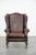This charming and classic, smooth, cowhide Chesterfield wing chair in a beautiful brown color easily complements almost...