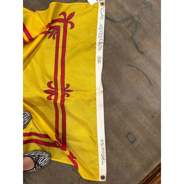 This is a late 20th century vintage Scotland flag. It has a red lion and a border on a gold field. It has metal rings easy...