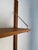 An original Scandinavian modular wall system from the 1960s, crafted in teak. Its light, minimalist construction is...