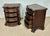 Elegant pair of French Louis XV style bedside chests featuring a richly carved bombe form and ornate brass hardware. Each...