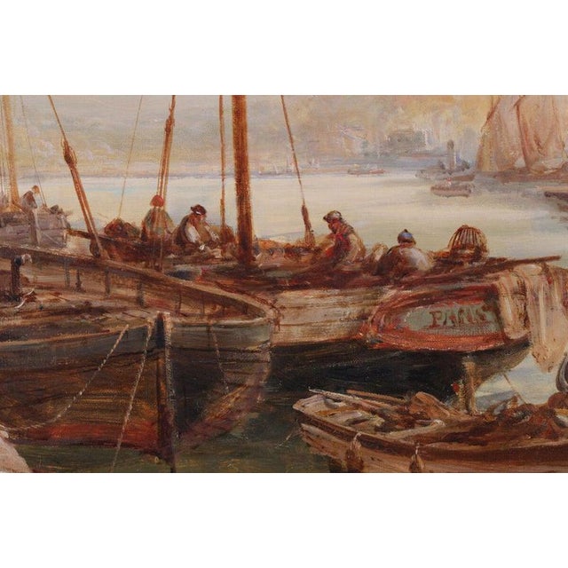 A substantial Victorian marine oil painting by William Webb (1862–1903), depicting a bustling coastal harbour populated...