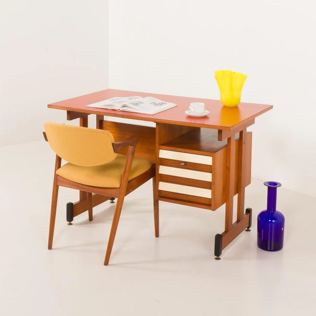 The stylish italian mid-century teak desk from the 1960s showcases the refined aesthetics typical of that era. The design...