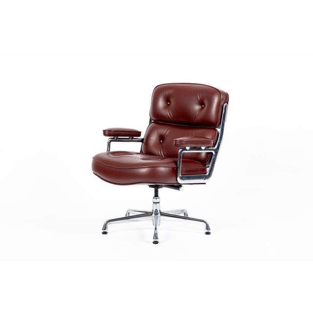 This red Model 3475 Eames Time Life Executive Lobby Chair designed by Charles & Ray Eames for Herman Miller was produced...