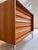 This striking chest of drawers, crafted from exquisite walnut, is a fantastic example of mid-century German furniture...