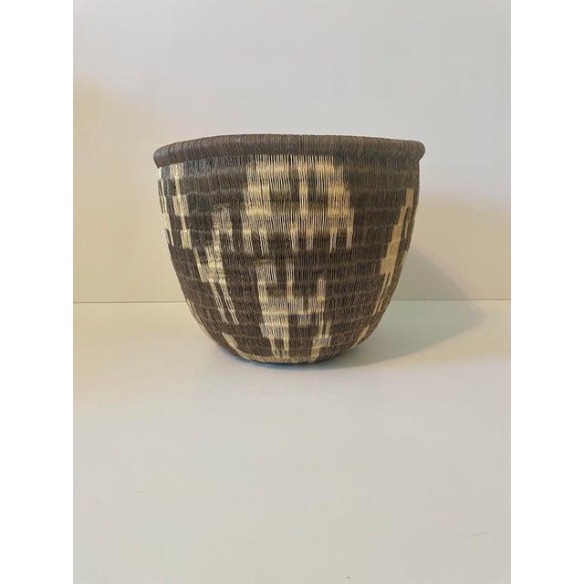 Elevate your space with this exceptional, museum-quality Wounaan-Embera coiled basket, meticulously handcrafted by...