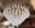 Italian chandelier shown with clear and light milky white Murano glass petals mounted on 24 k gold finish frame / Designed...