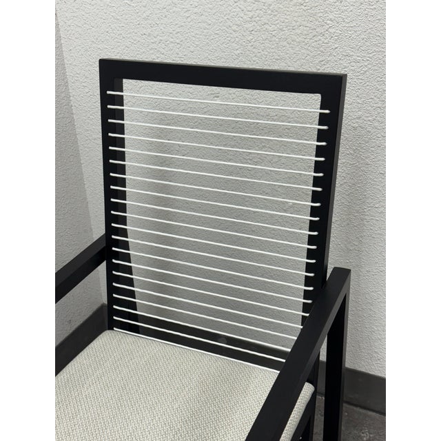 Design Plus Gallery presents a Astoria Style Arm Chair by Vesta Furniture. A graphic study in contrast and line, the chair...