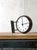 A double-sided slave clock by Gents of Leicester from the 1940s, in a Bakelite housing on a steel wall bracket, readable...