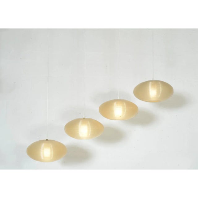 A rare set of four post war ceiling lights designed by john and sylvia reid for rotaflex gb, established by bernard stern....