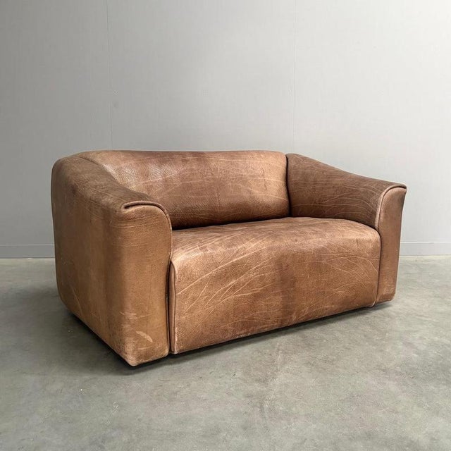 Remarks: Vintage design sofa by De Sede, model DS47, Switzerland 1970s. Best quality thick buffalo brown leather. Sofa is...