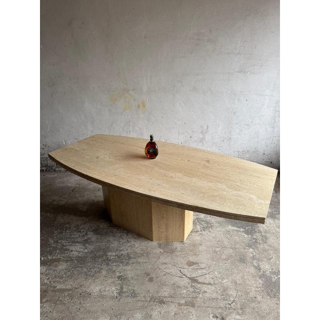 Sculptural Travertine Dining Table – 1970s Brutalist Design This striking vintage dining table is crafted entirely from...