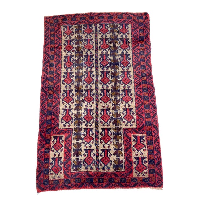 This hand-knotted Wool Baluch Prayer Rug from Central Asia has maintained its original, good condition. It features a...