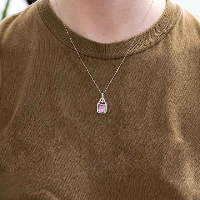 A stunning 4.5ct kunzite pendant set in solid 14K gold, accented with sparkling earth-mined diamonds. Featuring a graceful...