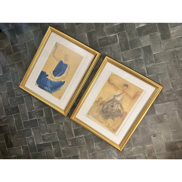 A pair of 1990s Auguste Rodin (French, 1840-1917) offset lithograph prints, framed in gold frames. Stamped on the lower...