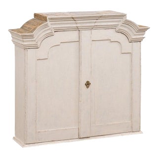 1770s Swedish Rococo Painted Wall Cabinet with Chapeau de Gendarme Style Cornice For Sale