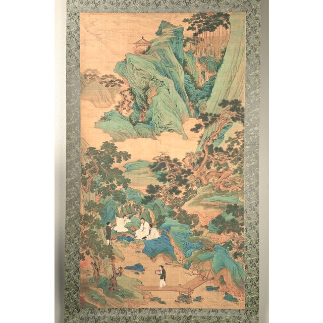 Chinese landscape scroll, freely drawn colored inks on silk, mounted on a shimmering, light and dark gold and grey, silk...